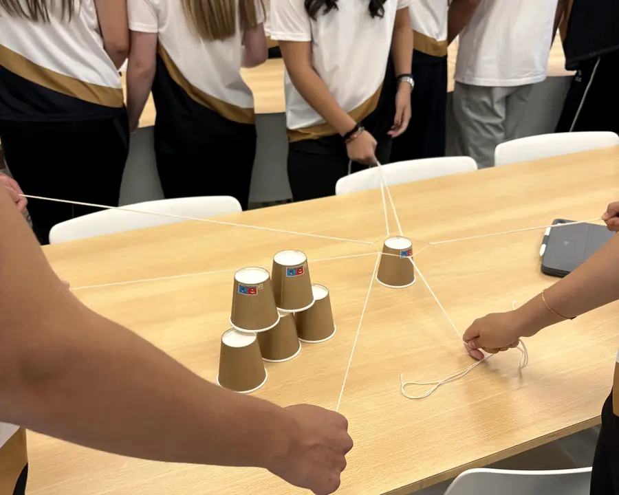 Team challenge with cups and strings